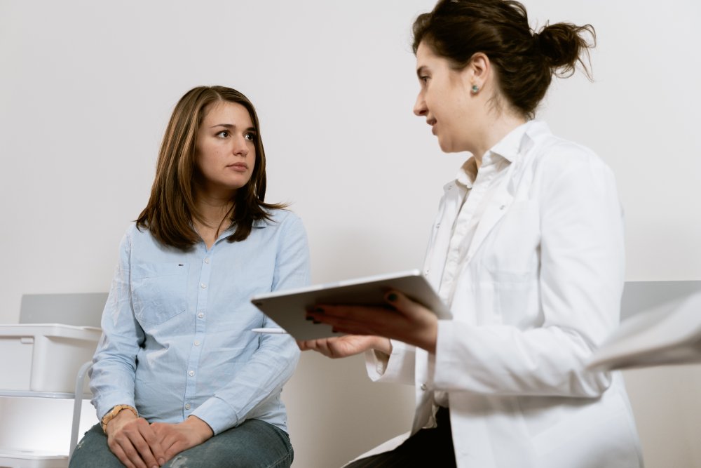 A doctor and patient discussing treatment